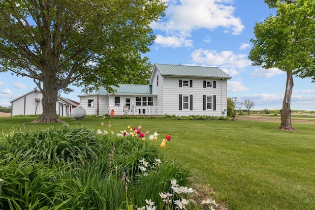 W13491 Reeds Corners Rd, Ripon, WI 54971 - rear view of property featuring a yard and metal roof