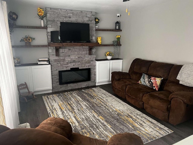 24 W Cottonwood Ln, Milton, WI 53563 - living room featuring a fireplace and dark wood-style floors