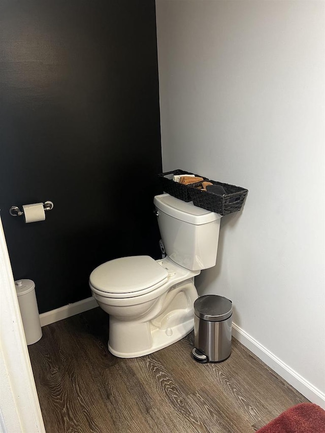 24 W Cottonwood Ln, Milton, WI 53563 - bathroom with wood finished floors, toilet, and baseboards