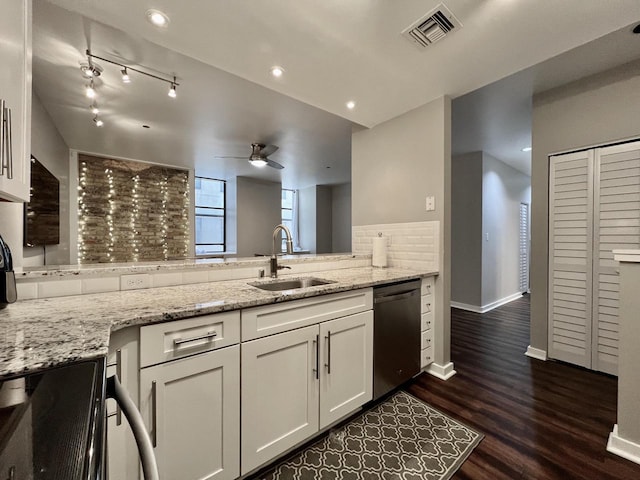 234 N Broadway Unit 302, Milwaukee, WI 53202 - kitchen with dishwasher, a sink, a ceiling fan, white cabinets, and dark wood-type flooring