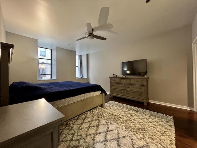 234 N Broadway Unit 302, Milwaukee, WI 53202 - bedroom with dark wood finished floors, baseboards, and ceiling fan