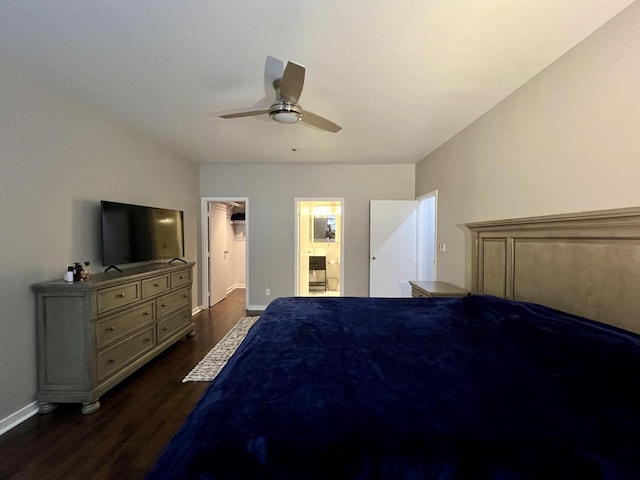 234 N Broadway Unit 302, Milwaukee, WI 53202 - bedroom featuring dark wood-style flooring, baseboards, a walk in closet, a ceiling fan, and connected bathroom