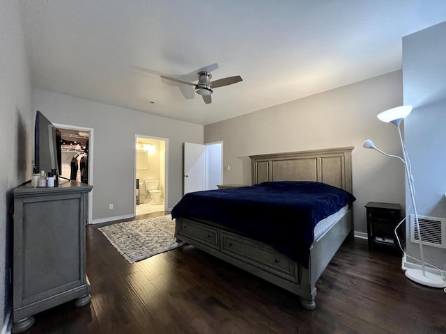 234 N Broadway Unit 302, Milwaukee, WI 53202 - bedroom with wood finished floors, baseboards, ceiling fan, and connected bathroom