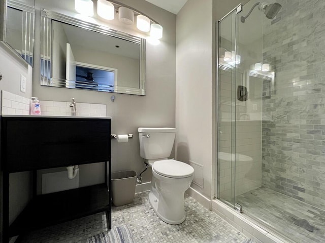 234 N Broadway Unit 302, Milwaukee, WI 53202 - bathroom featuring a stall shower, toilet, baseboards, tile patterned flooring, and vanity