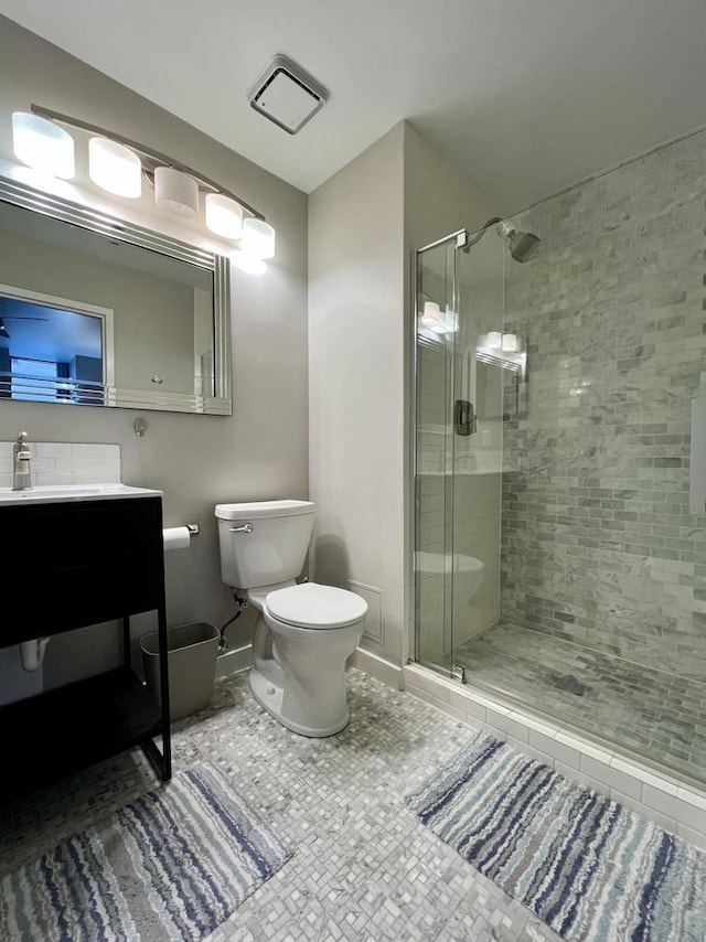 234 N Broadway Unit 302, Milwaukee, WI 53202 - full bath with tile patterned floors, a shower stall, toilet, and vanity