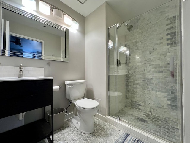 234 N Broadway Unit 302, Milwaukee, WI 53202 - full bathroom with a stall shower, toilet, baseboards, tile patterned flooring, and vanity