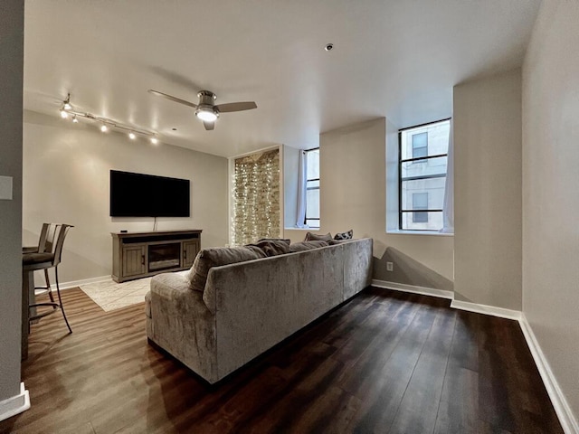 234 N Broadway Unit 302, Milwaukee, WI 53202 - living area featuring baseboards and dark wood-type flooring
