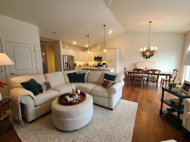 609 Cadence Cir, Lake Geneva, WI 53147 - living room featuring dark wood-type flooring, lofted ceiling, and a chandelier