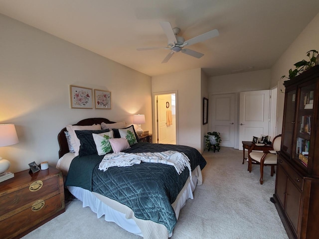 609 Cadence Cir, Lake Geneva, WI 53147 - bedroom with light carpet, a ceiling fan, and ensuite bath