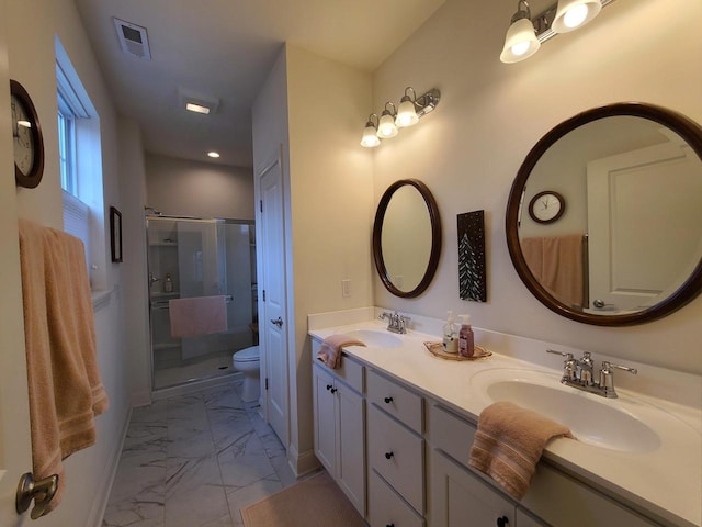 609 Cadence Cir, Lake Geneva, WI 53147 - bathroom with marble look tiles, a stall shower, toilet, double vanity, and recessed lighting