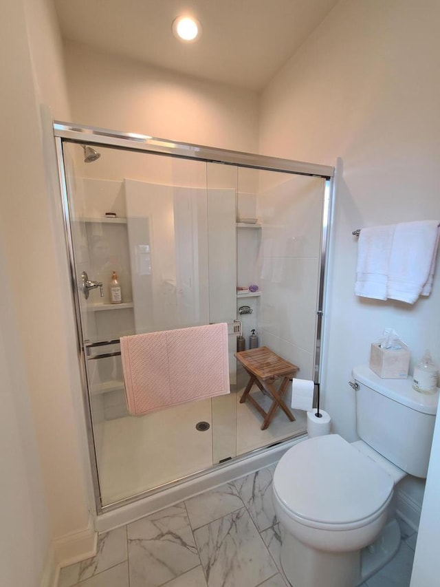 609 Cadence Cir, Lake Geneva, WI 53147 - full bathroom with marble look tile flooring, a stall shower, and toilet