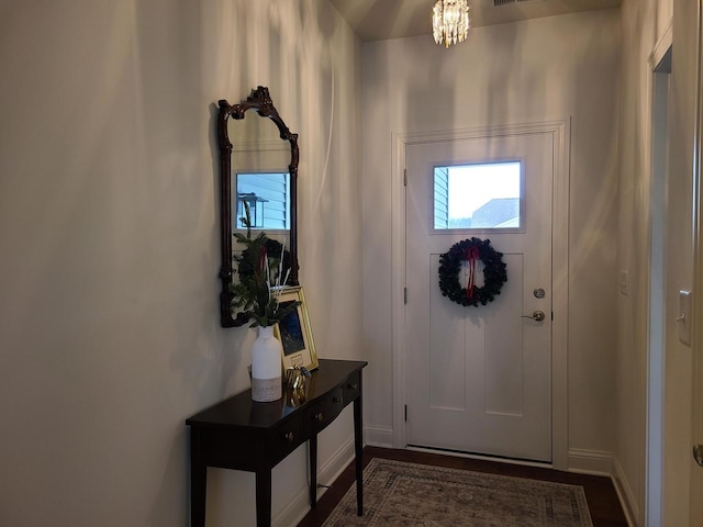 609 Cadence Cir, Lake Geneva, WI 53147 - foyer with plenty of natural light, a chandelier, and baseboards