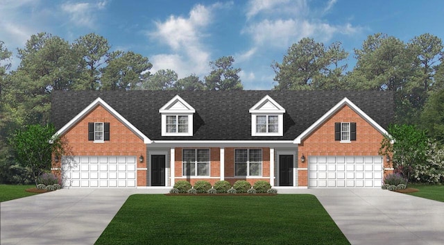 609 Cadence Cir, Lake Geneva, WI 53147 - view of front facade featuring driveway, brick siding, and a front yard