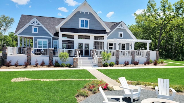 609 Cadence Cir, Lake Geneva, WI 53147 - rear view of property with a pergola, a lawn, a standing seam roof, roof with shingles, and metal roof
