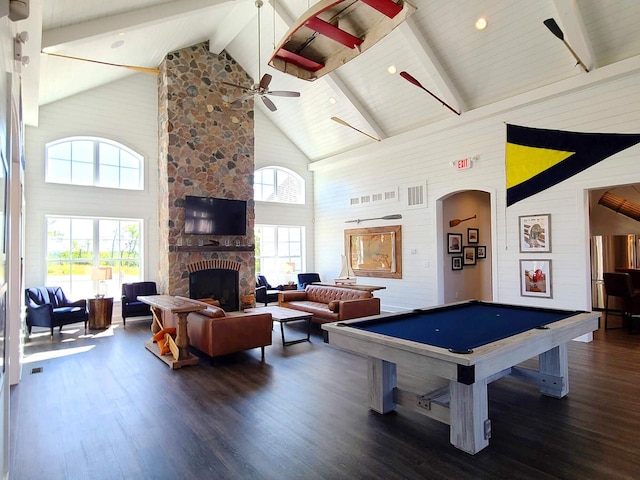 609 Cadence Cir, Lake Geneva, WI 53147 - game room with high vaulted ceiling, arched walkways, beamed ceiling, wood finished floors, and a fireplace