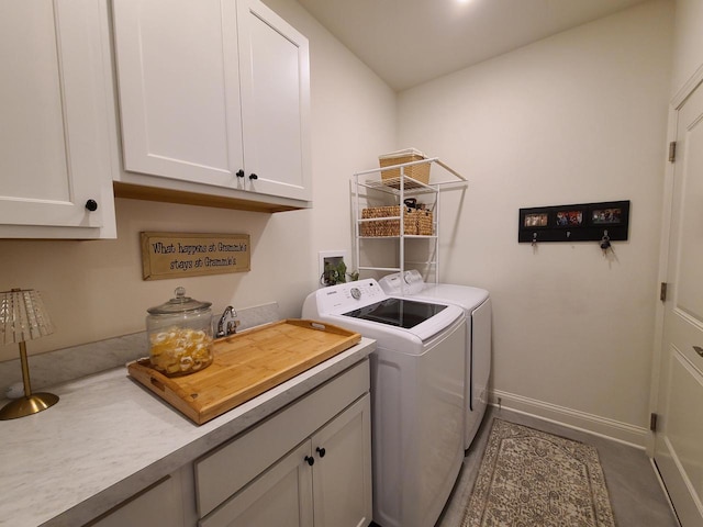 609 Cadence Cir, Lake Geneva, WI 53147 - washroom featuring washing machine and dryer, cabinet space, and baseboards