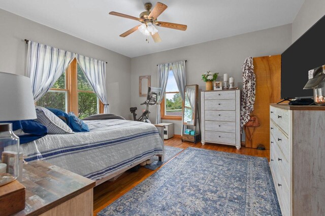 W13549 Reeds Corners Rd, Ripon, WI 54971 - bedroom featuring wood finished floors and a ceiling fan