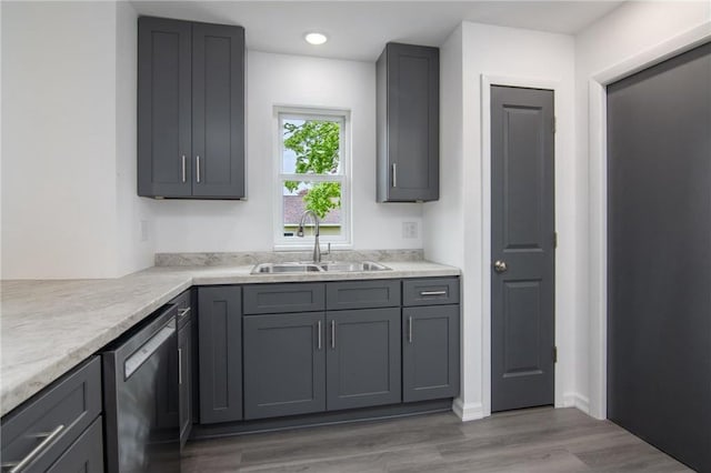 619 Aspen Ave, Amery, WI 54001 - kitchen featuring a sink, dishwasher, gray cabinetry, wood finished floors, and recessed lighting