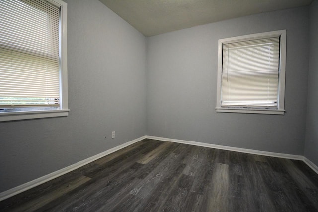 4618 N 36th St, Milwaukee, WI 53209 - spare room with dark wood finished floors, baseboards, and lofted ceiling