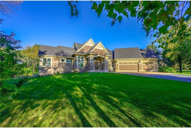 278 Saint Annes Pkwy, Hudson, WI 54016 - craftsman-style house with stone siding, an attached garage, a front yard, and driveway