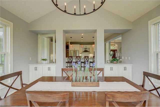 278 Saint Annes Pkwy, Hudson, WI 54016 - dining room featuring lofted ceiling, a chandelier, and wood finished floors