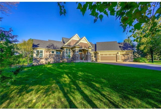 278 Saint Annes Pkwy, Hudson, WI 54016 - craftsman-style home featuring stone siding, a front lawn, a garage, and asphalt driveway