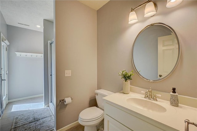 278 Saint Annes Pkwy, Hudson, WI 54016 - full bath with toilet, a stall shower, tile patterned flooring, vanity, and baseboards
