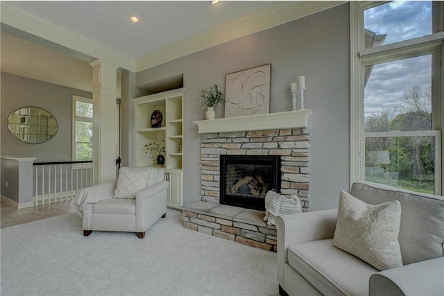 278 Saint Annes Pkwy, Hudson, WI 54016 - tiled living room with ornamental molding, built in features, carpet flooring, a fireplace, and baseboards