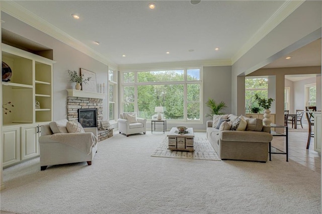 278 Saint Annes Pkwy, Hudson, WI 54016 - living area with light colored carpet, crown molding, a glass covered fireplace, and recessed lighting