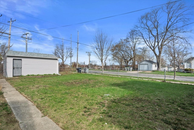 4193 N 19th Pl, Milwaukee, WI 53209 - view of yard featuring a detached garage and an outbuilding