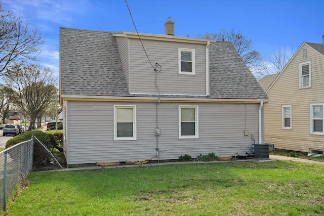 4193 N 19th Pl, Milwaukee, WI 53209 - rear view of property with roof with shingles, a chimney, and central AC