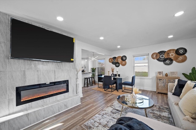 4193 N 19th Pl, Milwaukee, WI 53209 - living area featuring a large fireplace, wood finished floors, recessed lighting, and baseboards