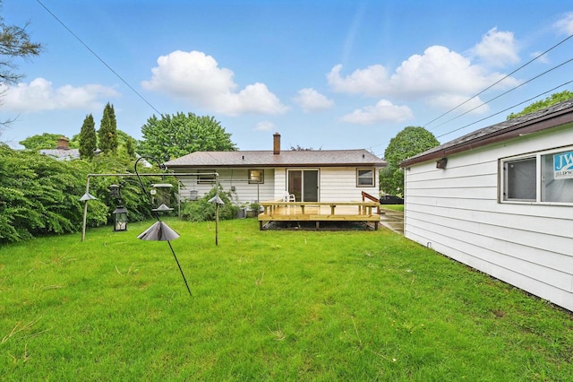 4349 N 80th St, Milwaukee, WI 53222 - rear view of house with a wooden deck, a yard, and a chimney
