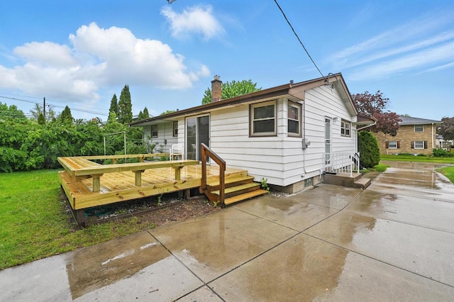 4349 N 80th St, Milwaukee, WI 53222 - rear view of house featuring a chimney, a wooden deck, and a patio