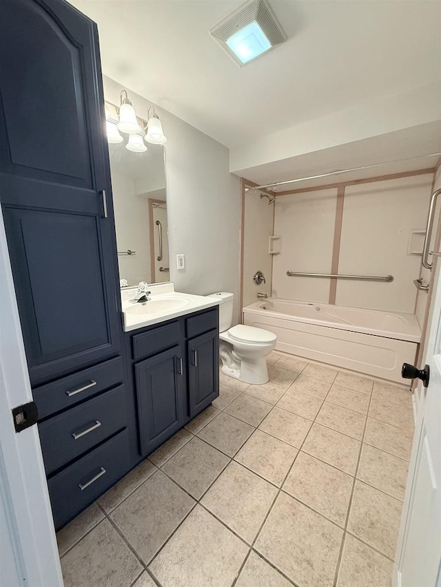 2107 W Grand Ave, Beloit, WI 53511 - full bathroom with tile patterned flooring, vanity, tub / shower combination, and toilet