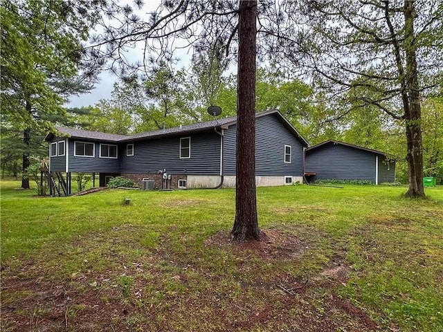 8054 223rd St, Cadott, WI 54727 - back of property with a yard and central AC unit