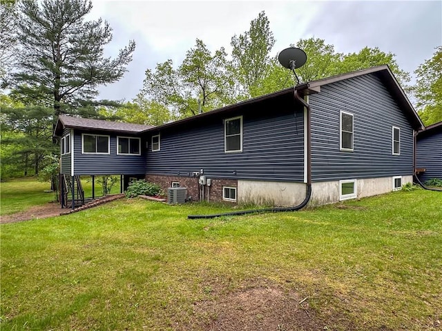 8054 223rd St, Cadott, WI 54727 - rear view of property with cooling unit and a yard