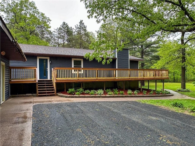 8054 223rd St, Cadott, WI 54727 - view of front of property featuring a wooden deck, stairs, and a shingled roof