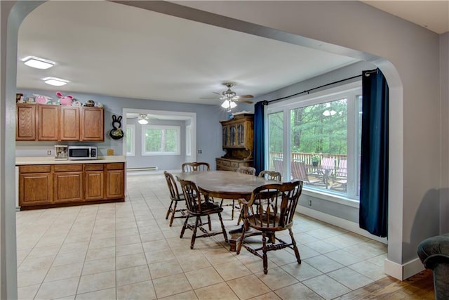 8054 223rd St, Cadott, WI 54727 - dining area with arched walkways, baseboards, and plenty of natural light
