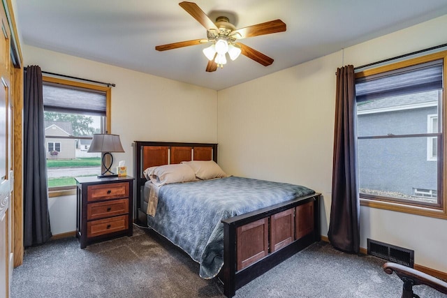 2424 Glendale Ave, La Crosse, WI 54601 - bedroom featuring dark colored carpet, ceiling fan, and baseboards
