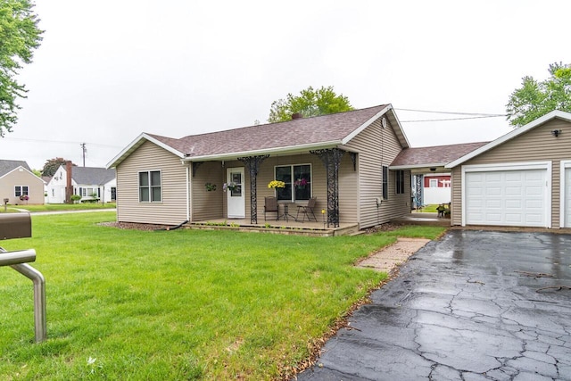 2424 Glendale Ave, La Crosse, WI 54601 - ranch-style house with a front lawn, covered porch, driveway, roof with shingles, and a garage