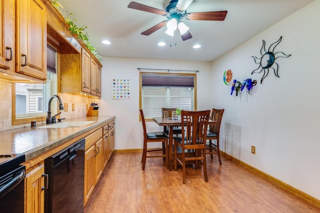 2424 Glendale Ave, La Crosse, WI 54601 - kitchen featuring black appliances, a sink, ceiling fan, backsplash, and light wood-style flooring