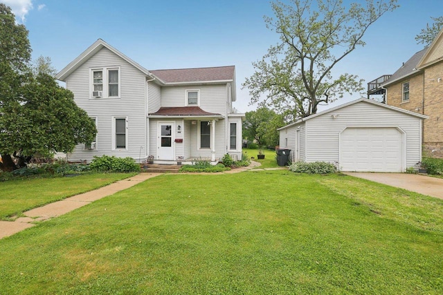 146 S Washington St, Waterloo, WI 53594 - view of front facade featuring a garage, concrete driveway, a front yard, roof with shingles, and an outbuilding
