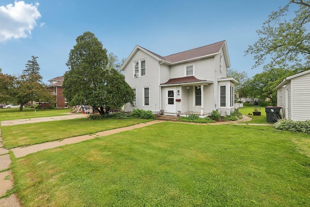146 S Washington St, Waterloo, WI 53594 - view of front of house featuring a front lawn and a shingled roof