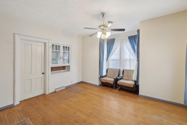 146 S Washington St, Waterloo, WI 53594 - unfurnished room with light wood-style floors, a ceiling fan, and baseboards