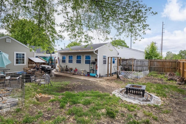 1667 Sherman Ave, Beloit, WI 53511 - rear view of house featuring a fire pit