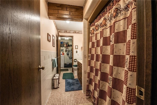 10790 Beal Ave, Hayward, WI 54843 - wine cellar with tile walls, tile patterned flooring, and wainscoting