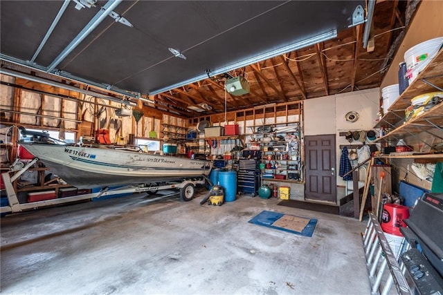 10790 Beal Ave, Hayward, WI 54843 - garage featuring a workshop area and a garage door opener