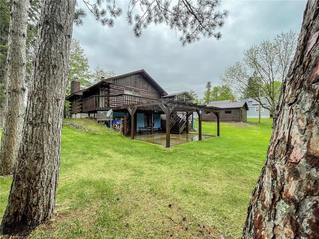 10790 Beal Ave, Hayward, WI 54843 - back of house featuring a wooden deck, stairway, a yard, and a chimney