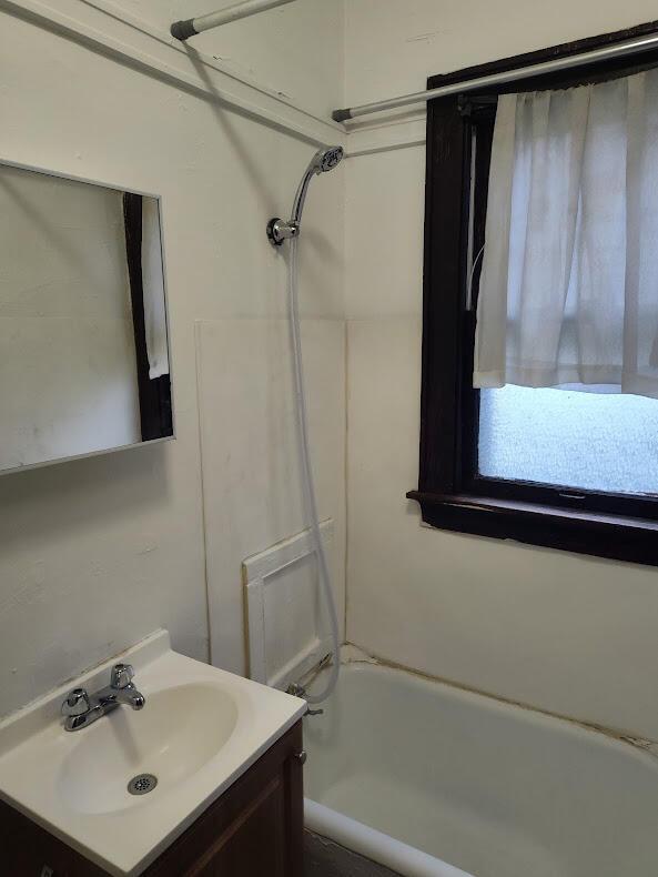 1832 S 18th St Unit 1834, Milwaukee, WI 53204 - bathroom with vanity and shower / washtub combination